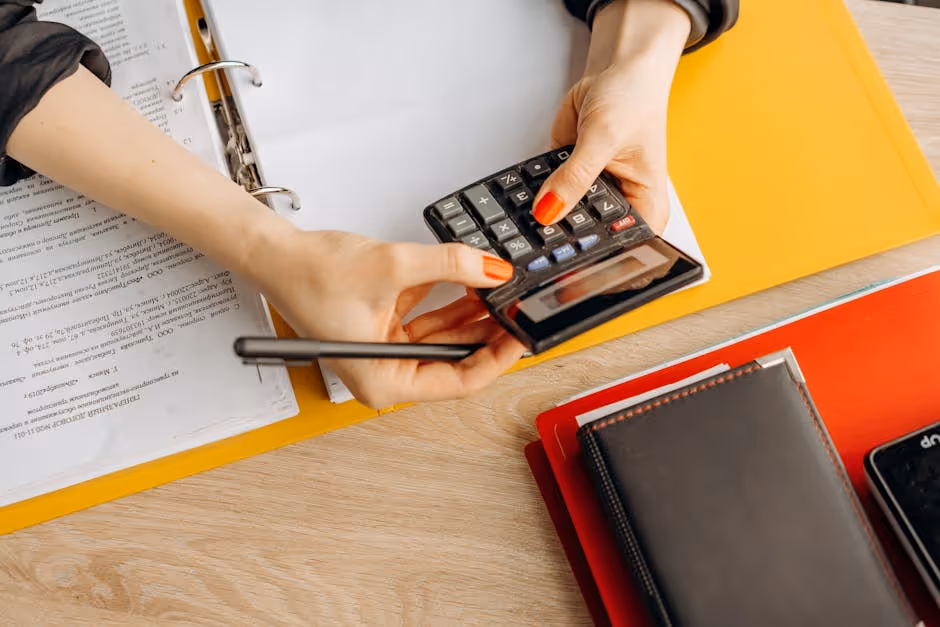 Accountant analyzing balance sheet and general ledger reports Accountant analyzing balance sheet and general ledger reports