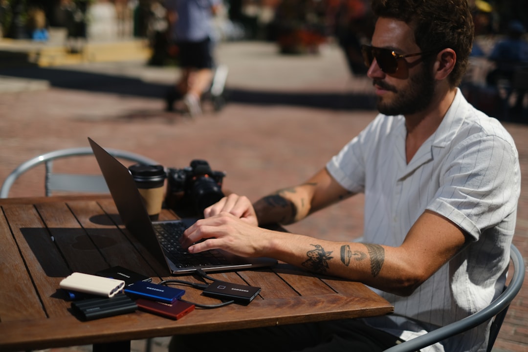 small business owner using laptop - best cloud based accounting for small business